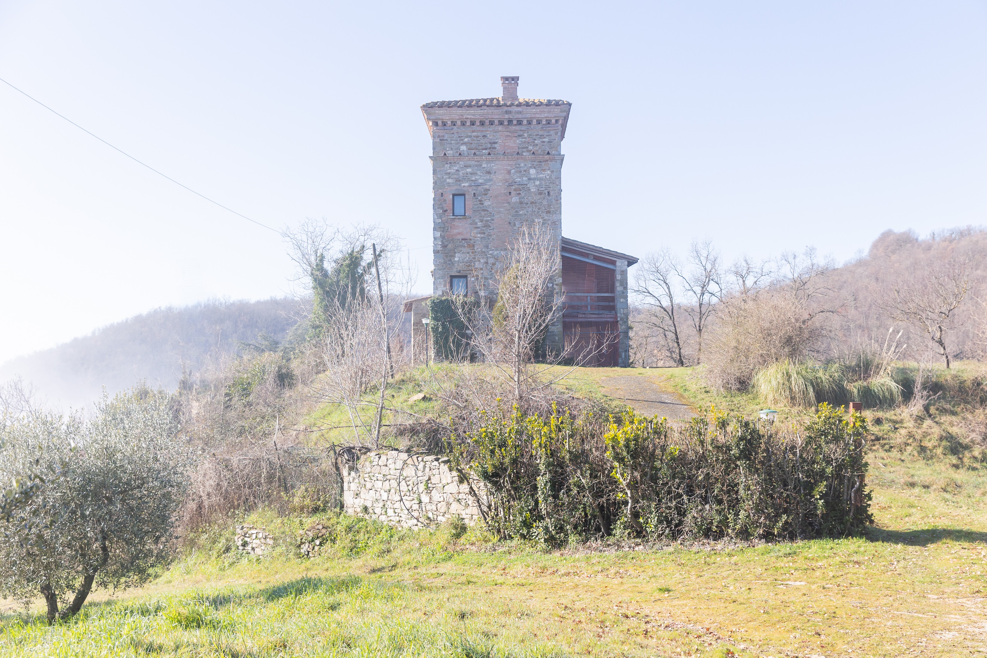 Torre behind the old medieval house-wall