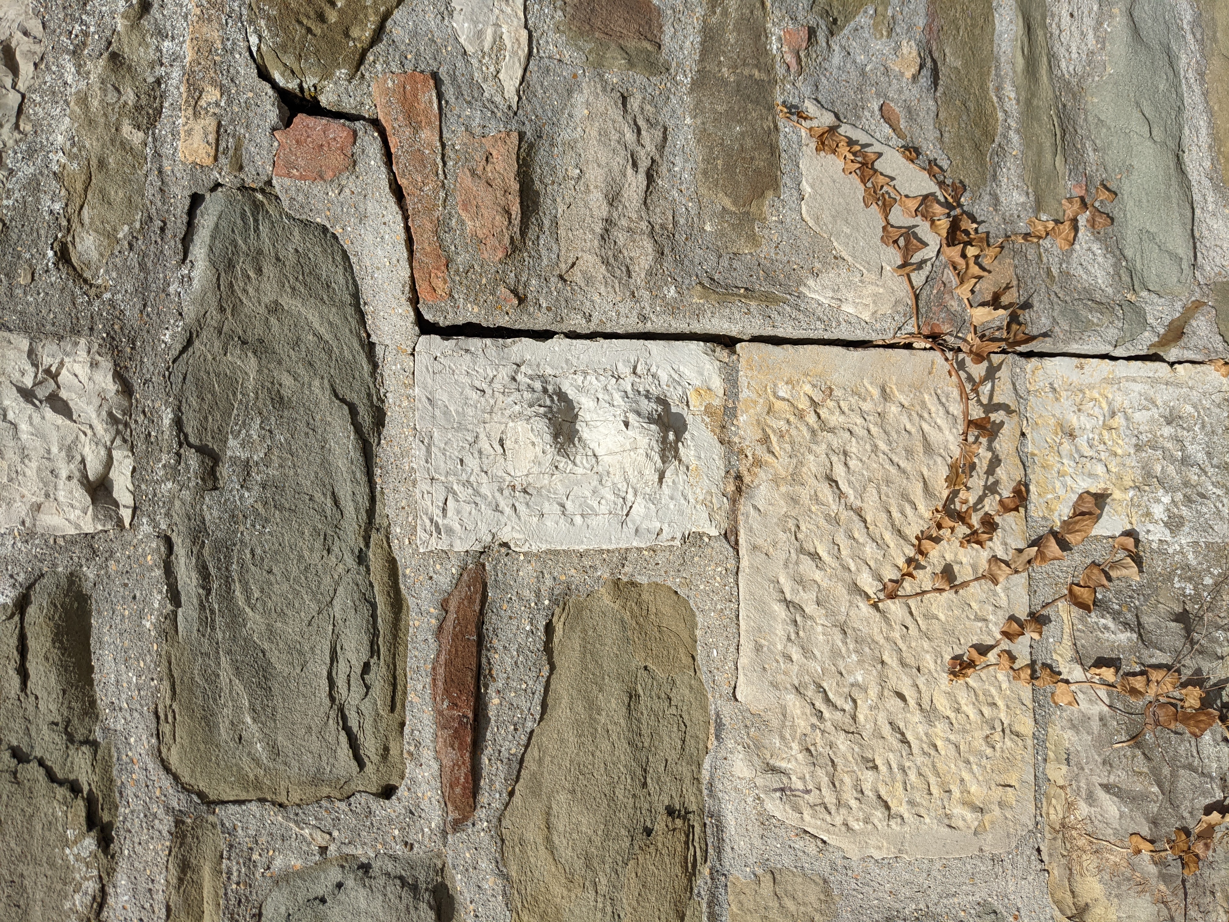 Roman spolia stones incorporated into the masonry walls